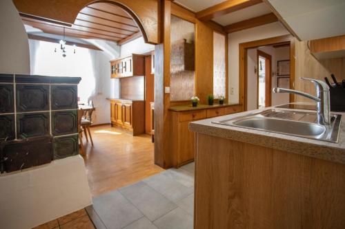 a kitchen with a sink and a counter top at Traditional Old Town Apartment in Hall in Tirol