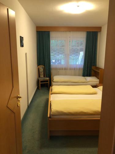 Postel nebo postele na pokoji v ubytování Hotel Residence Lorenz