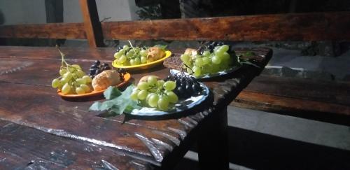 three bowls of fruit on a wooden table at Popock City Center in Yerevan