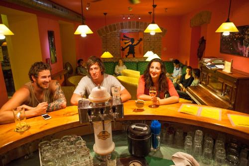 a group of people sitting at a bar at Vienna Hostel Ruthensteiner in Vienna