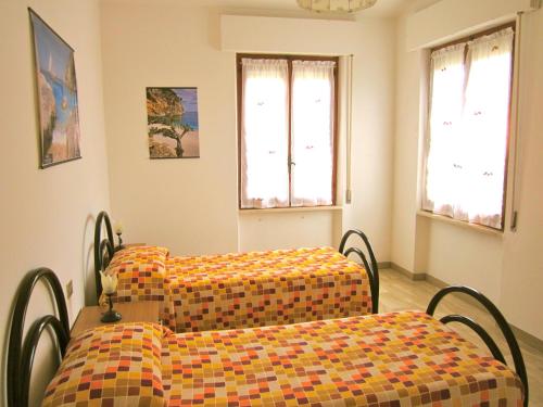 מיטה או מיטות בחדר ב-Villetta Tancau