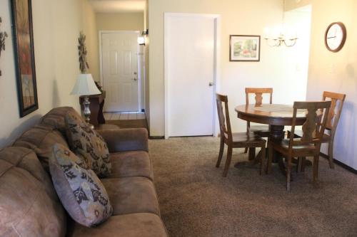a living room with a couch and a table at Gatlinburg Chateau Condo 510 in Gatlinburg