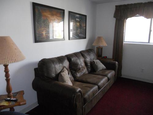 a brown leather couch in a living room at Oak Square 309 in Gatlinburg