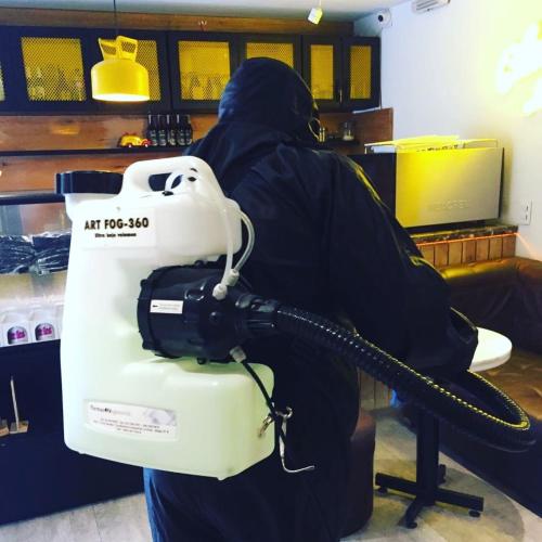 a person is holding a machine in a store at Villaviciosa Hotel Boutique in Pasto