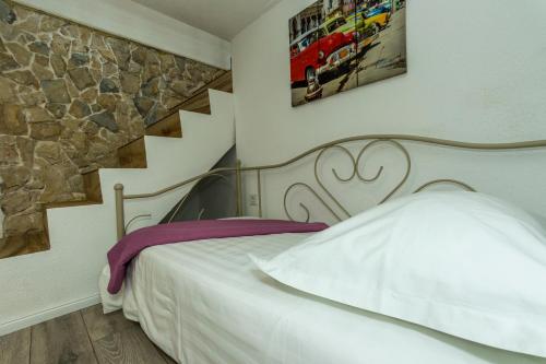 מיטה או מיטות בחדר ב-Bluesun Sibenik Apartments