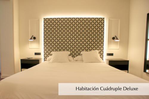 Ένα ή περισσότερα κρεβάτια σε δωμάτιο στο Hotel Montermoso