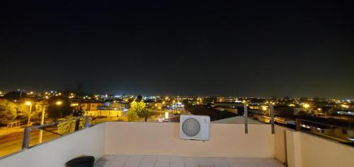 a view from the roof of a building at night at NCG SUITE SAMANES in Guayaquil
