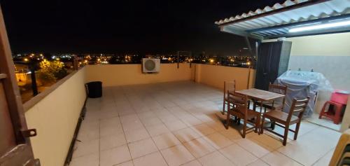 a view of a balcony with a table and chairs at NCG SUITE SAMANES in Guayaquil