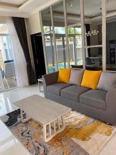 a living room with a couch and a coffee table at Marseillia Hills in Puncak