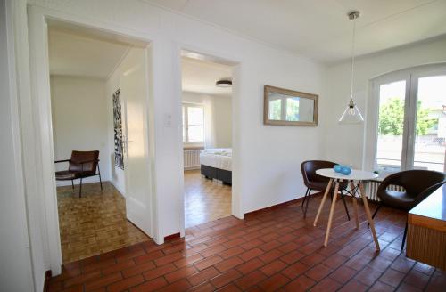 a living room with a bed and a table and chairs at Ferien in Glarus in Glarus