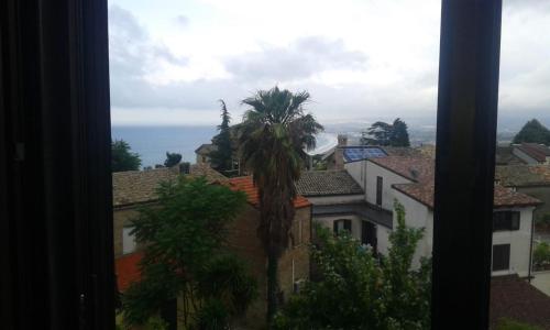 a view from a window of buildings and a palm tree at VASTO centro Alloggio 1-2-3 in Vasto