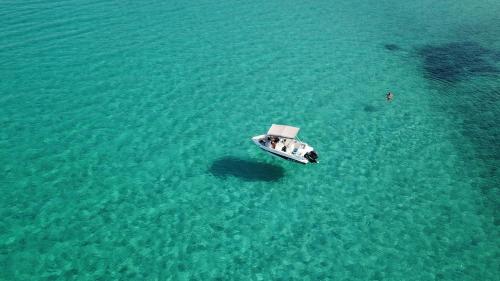 a boat in the middle of the water at Marina in Nikiti