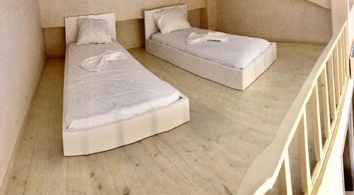 A bed or beds in a room at StelDi Luxury Apartments