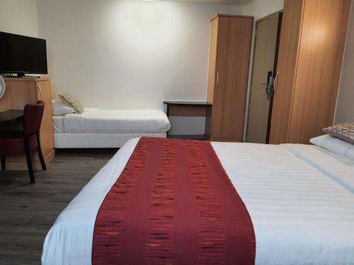 Ein Bett oder Betten in einem Zimmer der Unterkunft Hotel New Flanders
