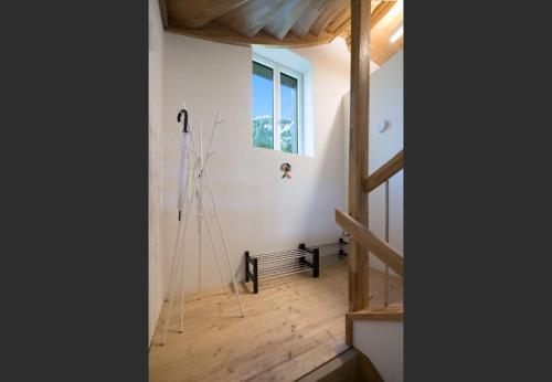 a room with a wooden floor and a window at Le Manoir Penthouse in Wengen