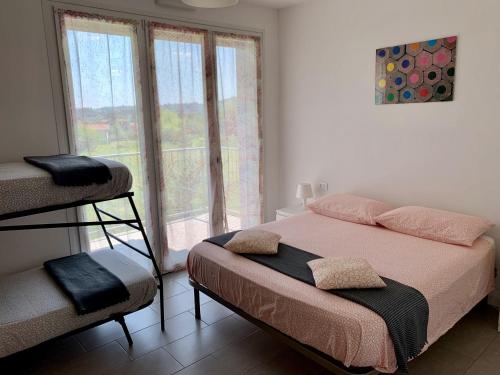 a bedroom with a bed and a window at Ennodio Apartment in Como
