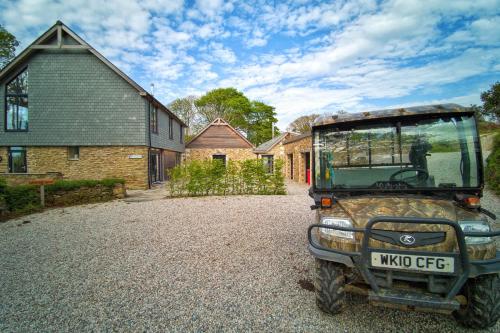 a jeep parked in front of a house at Glamping Yurts near Newquay in Newquay