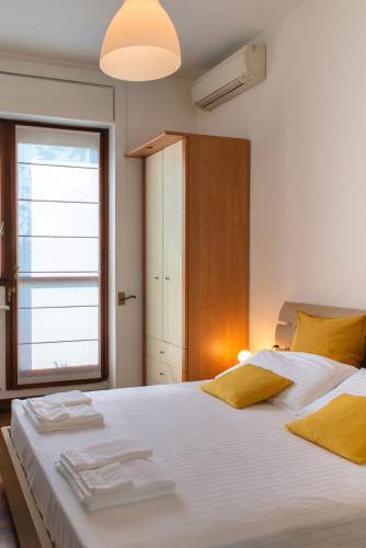 Ένα ή περισσότερα κρεβάτια σε δωμάτιο στο MilanoView Apartment