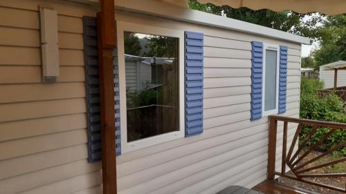 a window on a house with blue shutters at Les rives de Condrieu in Condrieu