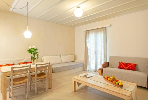 a living room with a couch and a table at Villa Iokasti in Hersonissos