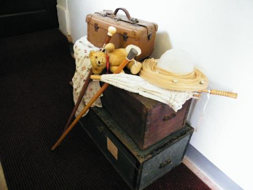 a stuffed teddy bear sitting on top of two chests at B&B Il Glicine in Montefollonico