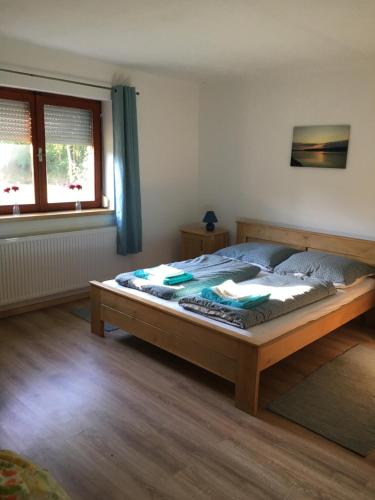 a bedroom with a large bed in a room at Elsa‘s Angelparadies in Dunafalva