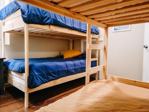 a bedroom with two bunk beds in a room at Indoor Pool, Firepit, Self Check-in, BBQ, FREE Amenities, KING Bed, Full Kitchen in Lake Ariel