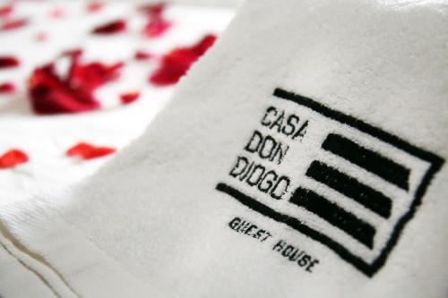 a close up of a white napkin with cherries at Casa Don Diogo - Guest House in Carviçais