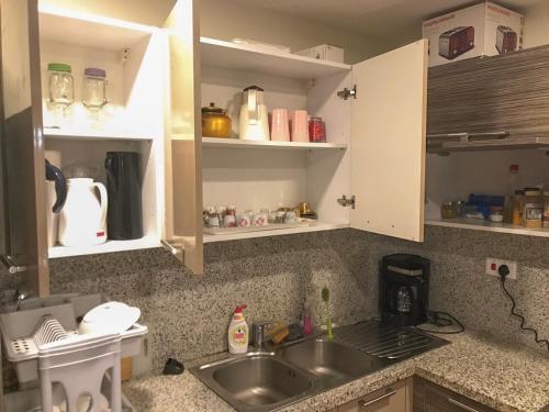 a kitchen with a sink and a counter top at Majestic_vip in Half Moon Bay