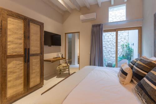 Postel nebo postele na pokoji v ubytování Casa Quebrada Hotel Boutique