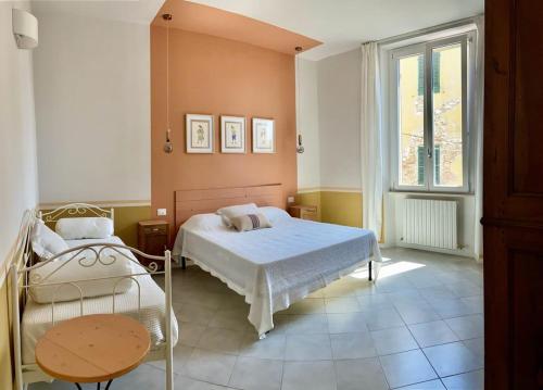 Кровать или кровати в номере Via Pisano 22 - la tua casa in centro