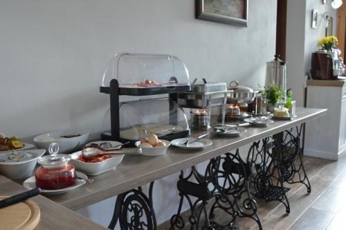 a table with food on it in a kitchen at Penzion Pod Rozhlednou in Janov