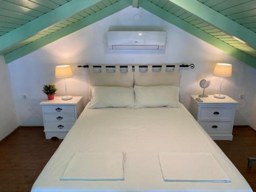 Ένα ή περισσότερα κρεβάτια σε δωμάτιο στο Thodoris Infinity View Apartments