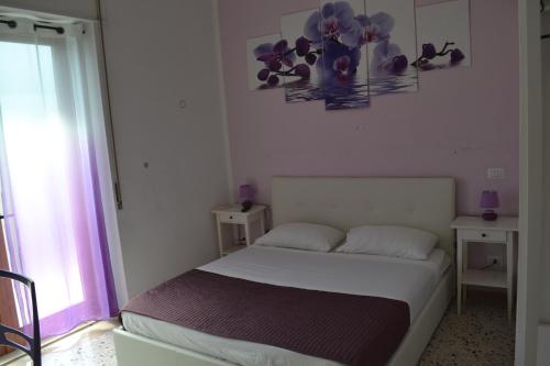 Postel nebo postele na pokoji v ubytování Sorrento Experience