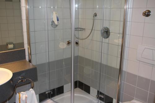 a bathroom with a shower and a sink at Hotel Ifen in Wiesloch