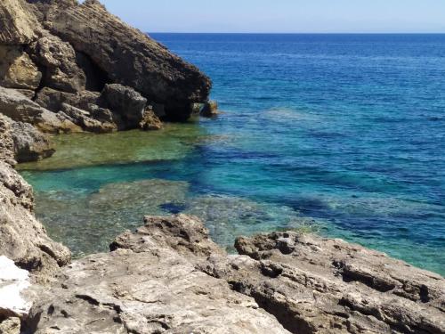 a view of the ocean from a rocky cliff at Loggos Summer House in Vasilikos