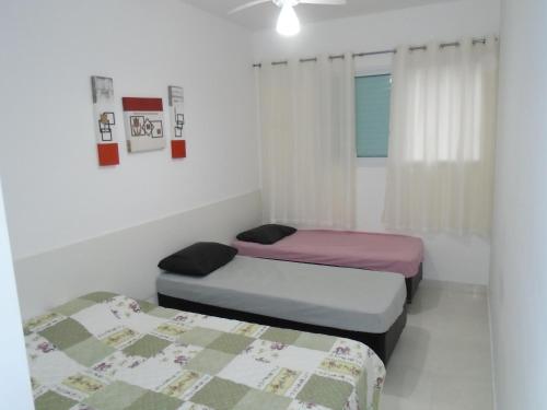Voodi või voodid majutusasutuse Apartamento em Mongaguá, Frente ao Mar toas
