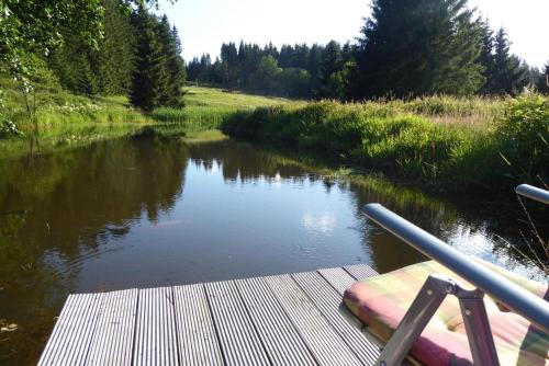 a view of a river from a boat on a dock at Pension Holl und Boll Am Hexenstieg. in Clausthal-Zellerfeld