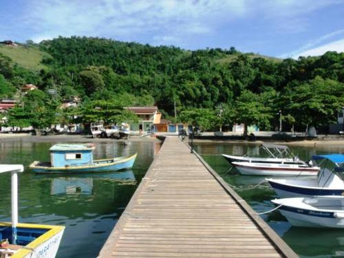 a group of boats docked at a dock at Pousada Nativa in Paraty