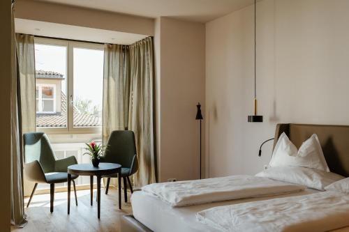 Postelja oz. postelje v sobi nastanitve Ansitz am Eck by Hotel Pernhof