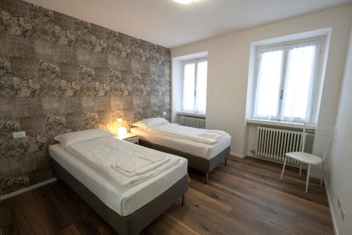 Posteľ alebo postele v izbe v ubytovaní Appartamento L’Anzolim