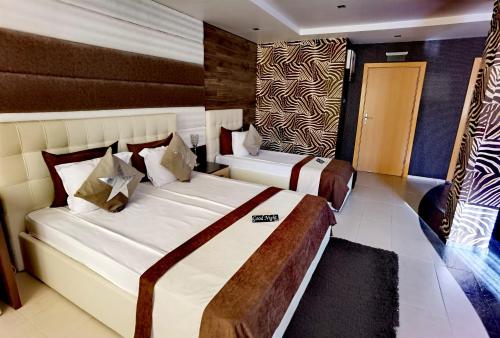 Postel nebo postele na pokoji v ubytování Hotel Acktion