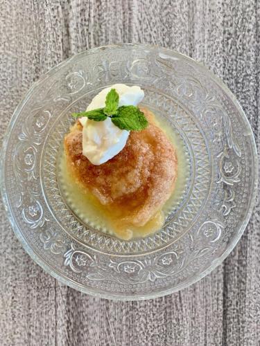 a pastry on a glass plate on a table at Annie's Place Bed & Breakfast in Boulder Town