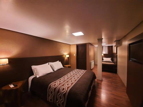 Una cama o camas en una habitación de Hospedaria Gaúcha