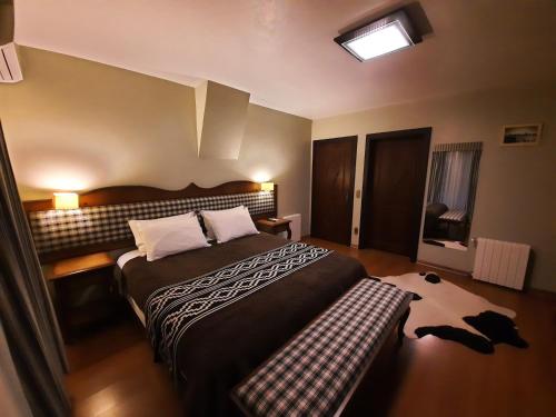 Una cama o camas en una habitación de Hospedaria Gaúcha