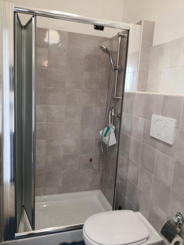 a bathroom with a shower and a toilet at B&B Il Papavero Rosso in Corigliano dʼOtranto