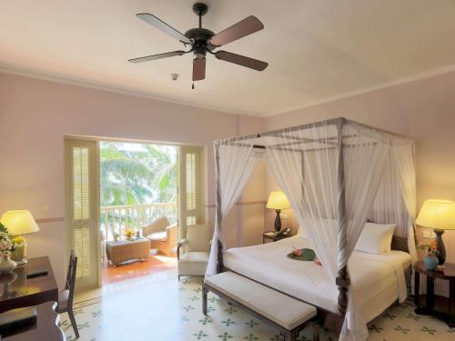 Postel nebo postele na pokoji v ubytování La Veranda Resort Phu Quoc - MGallery