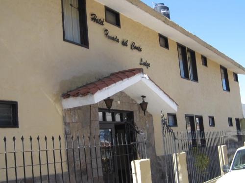 a building with a fence in front of it at La Posada del Conde Lodge in Cabanaconde