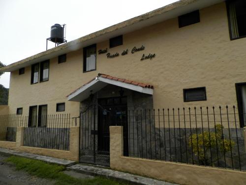a building with writing on the side of it at La Posada del Conde Lodge in Cabanaconde