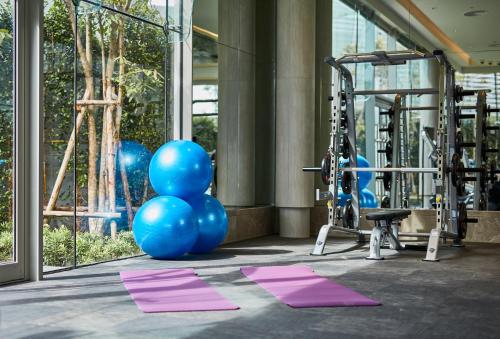 a gym with blue balloons and exercise equipment at Grande Centre Point Pattaya in Pattaya Central
